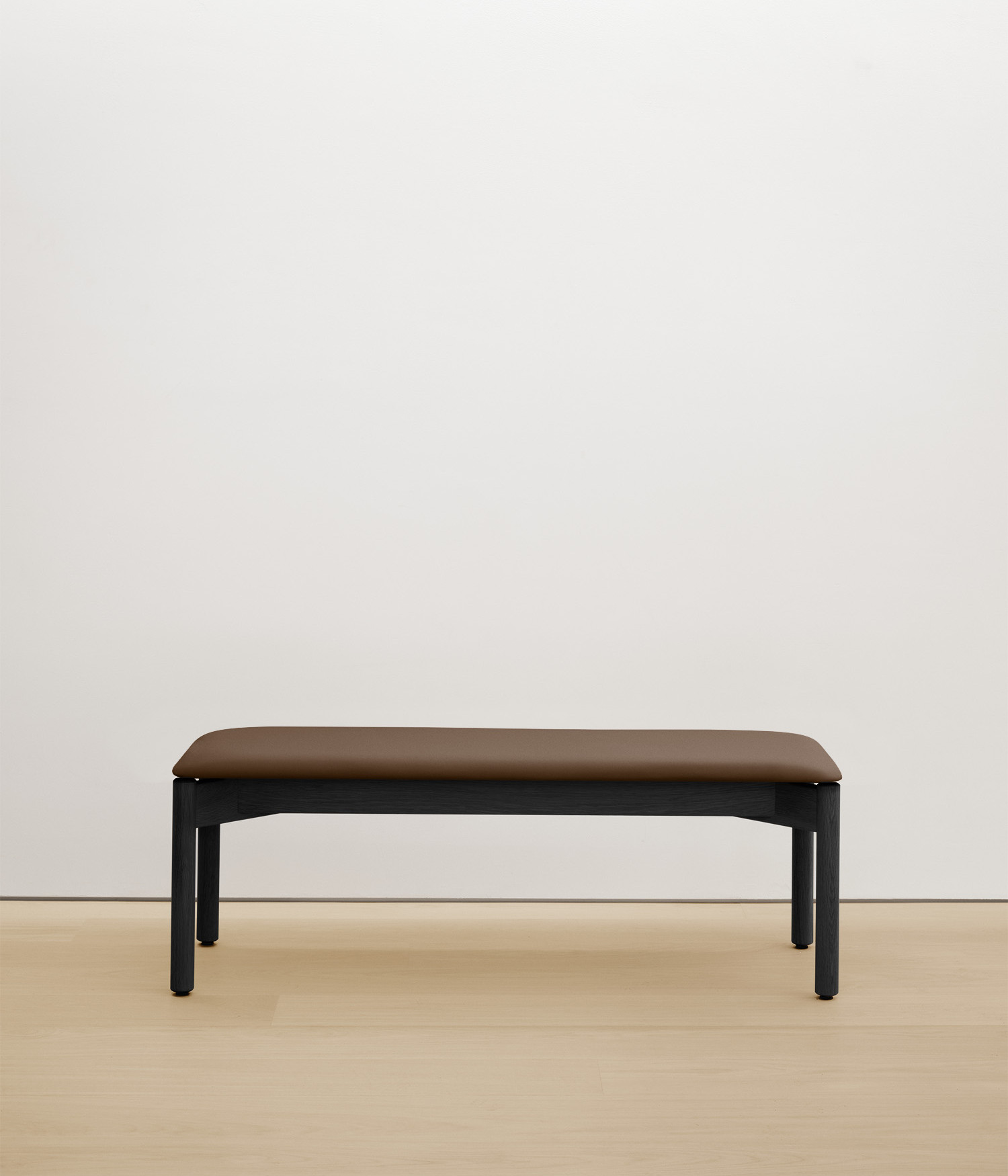  black-stained-oak bench with umber color upholstered seat