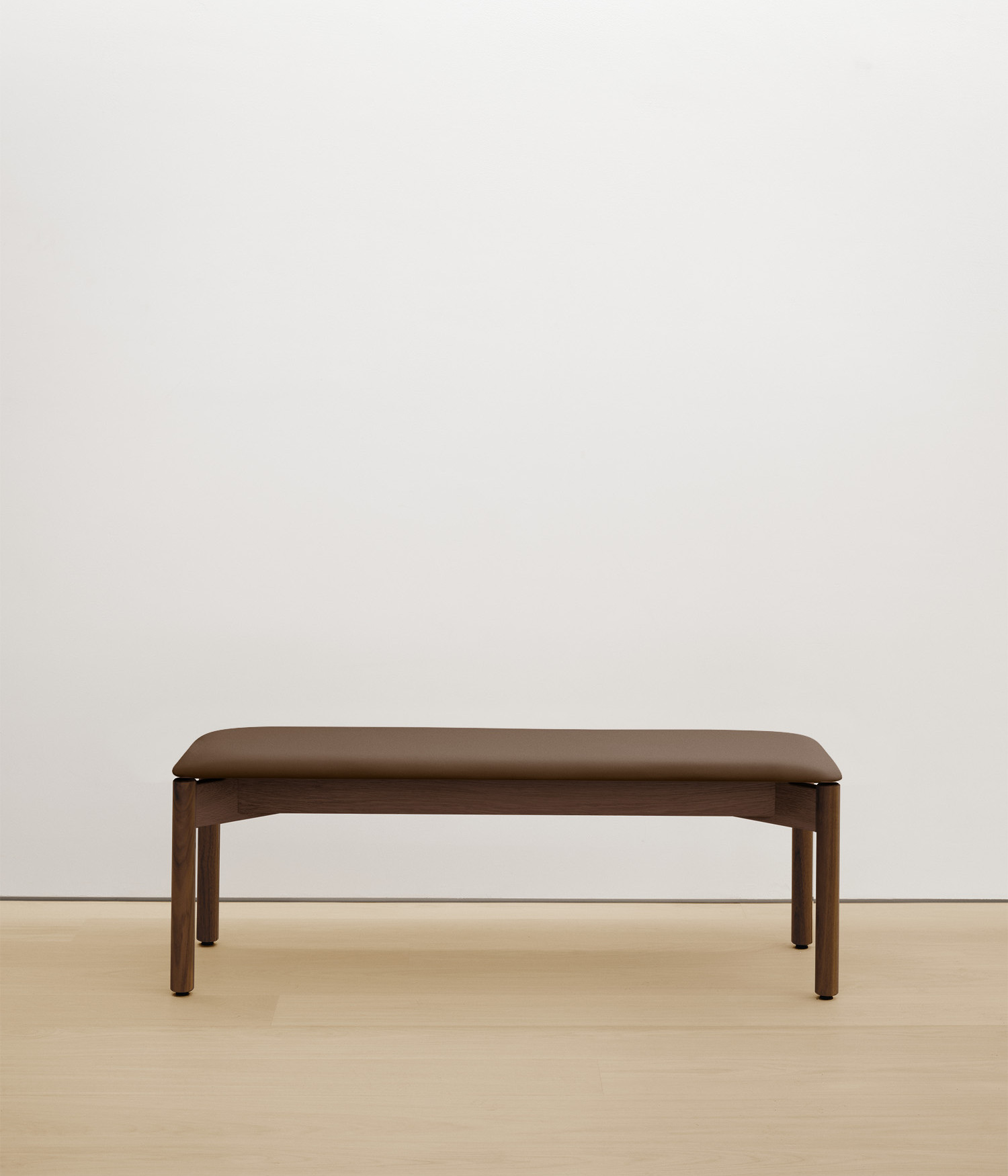  walnut bench with umber color upholstered seat