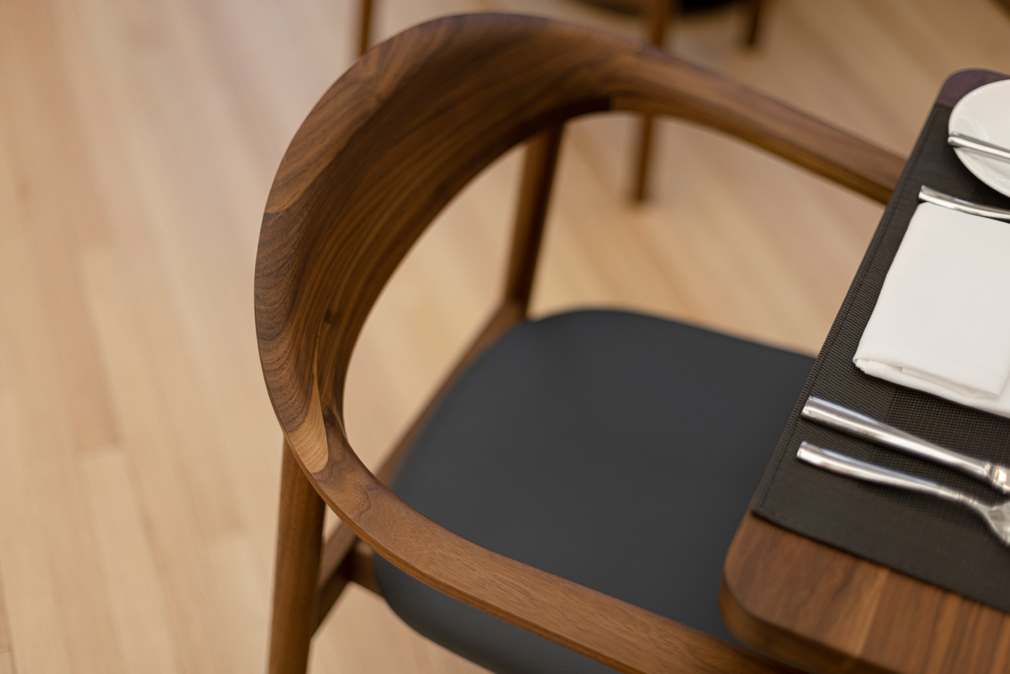 Top view of walnut Dune chair in Le Parlementaire restaurant