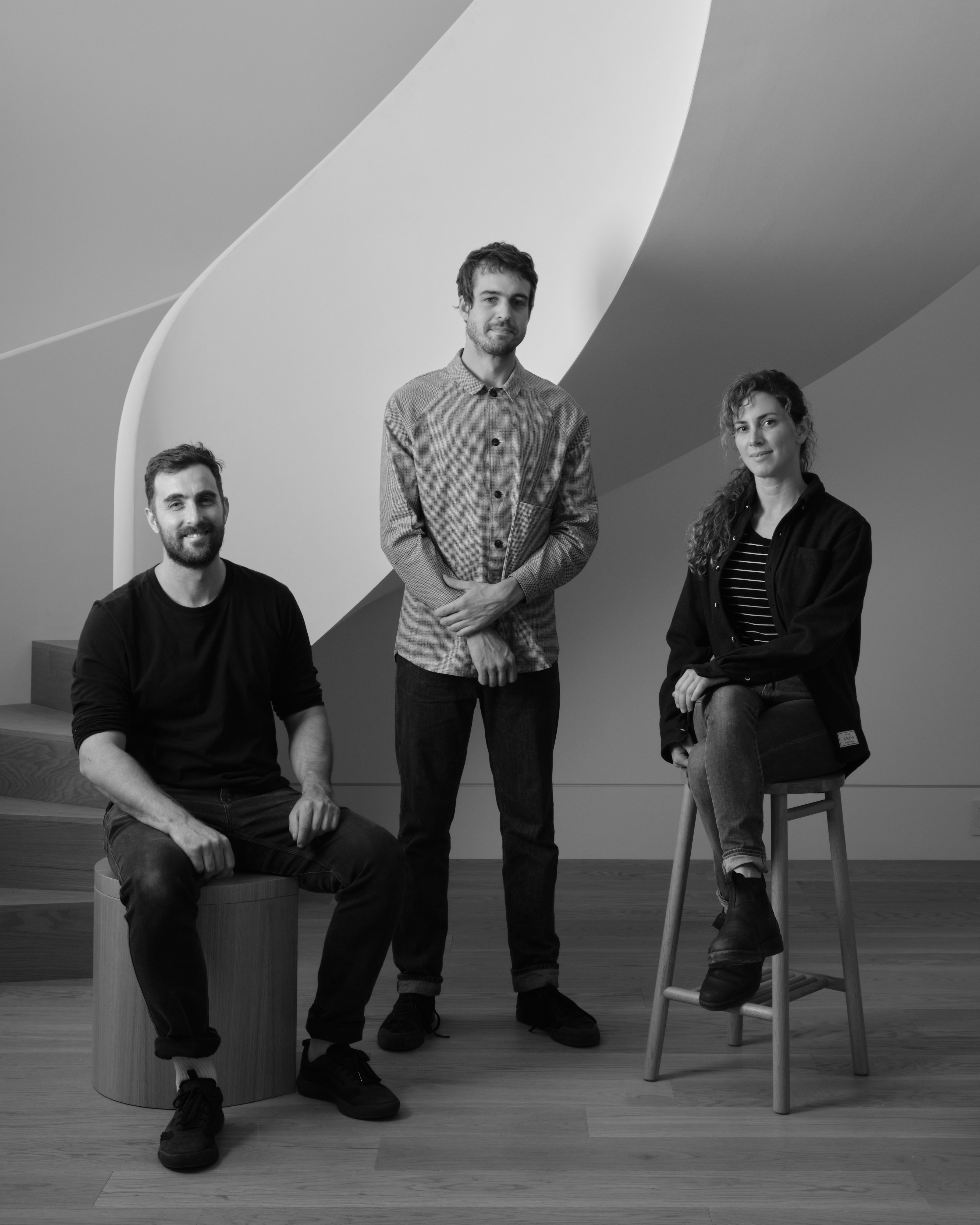 Portrait of the founders of Vaste against spiral staircase background