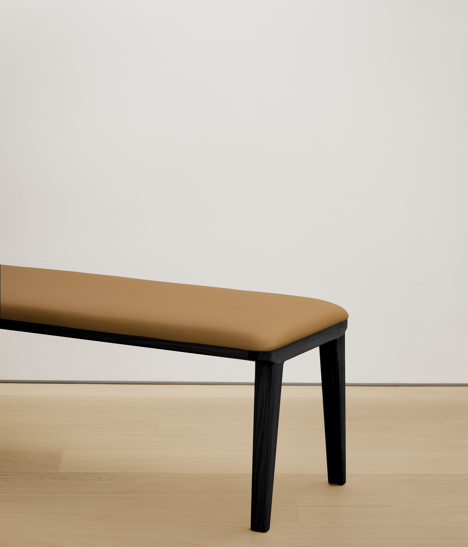  black-stained-oak bench with tan color upholstered seat 