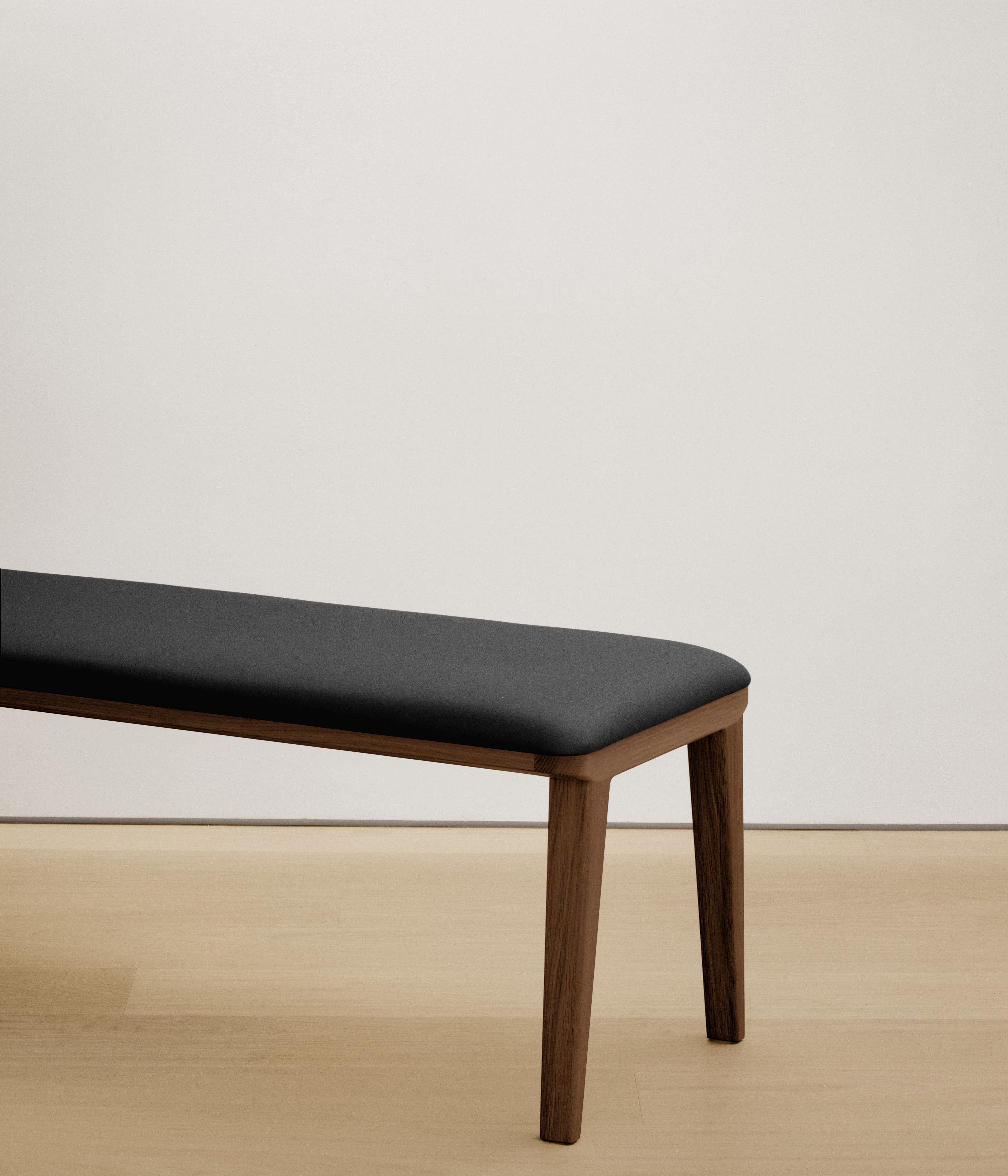  walnut bench with black color upholstered seat