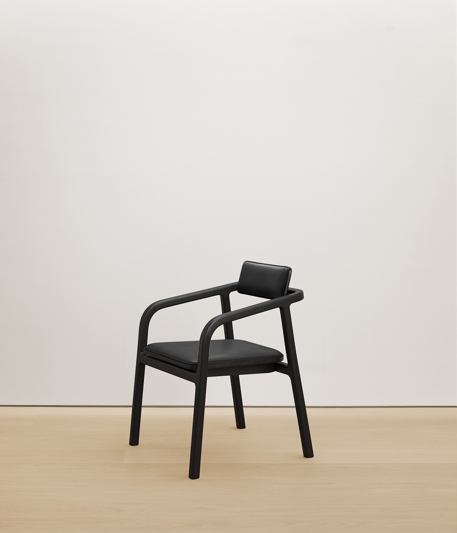  black-stained-oak chair with black color upholstered seat