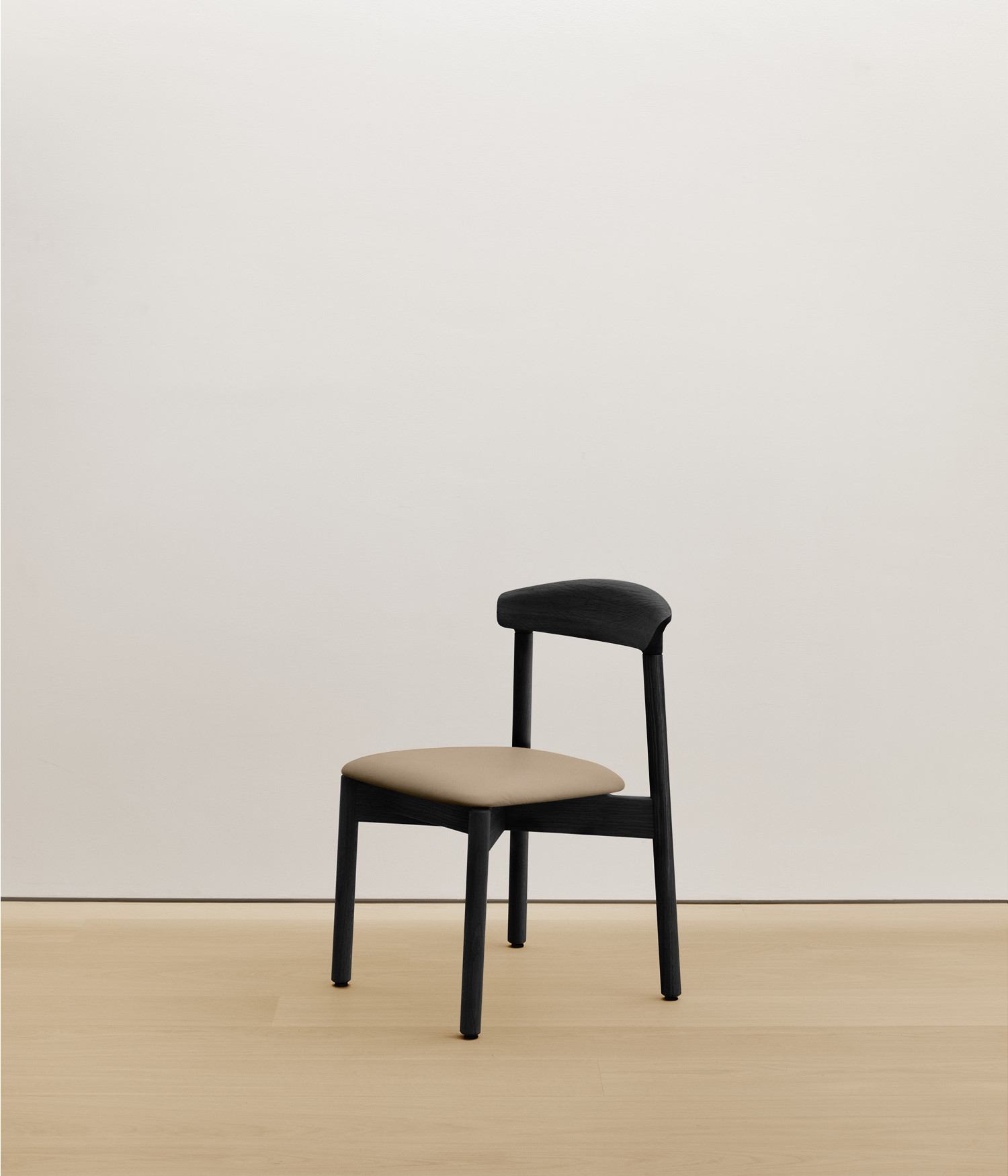  black-stained-oak chair with cream color upholstered seat 