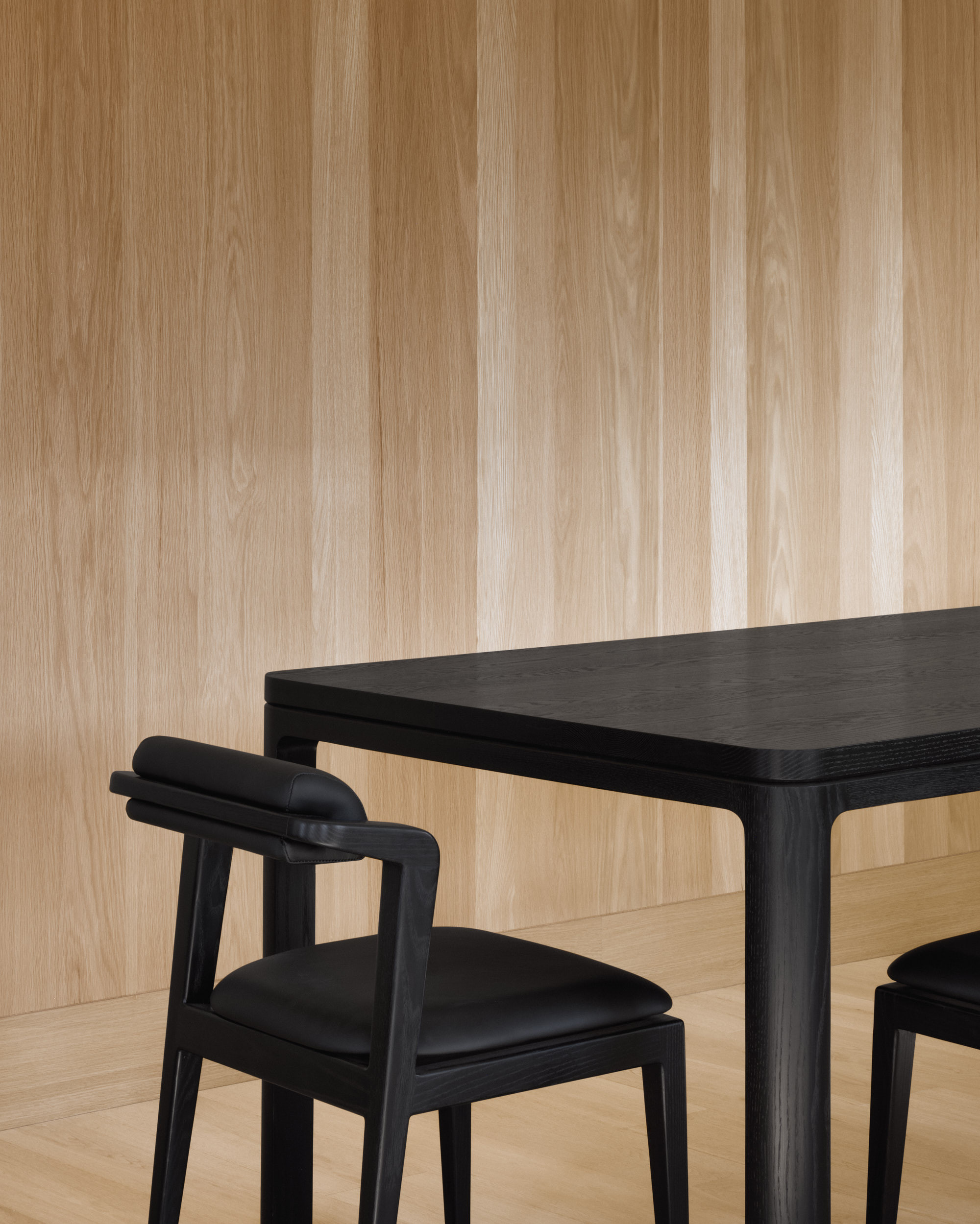 A detail view of the Nord table and chairs in all black