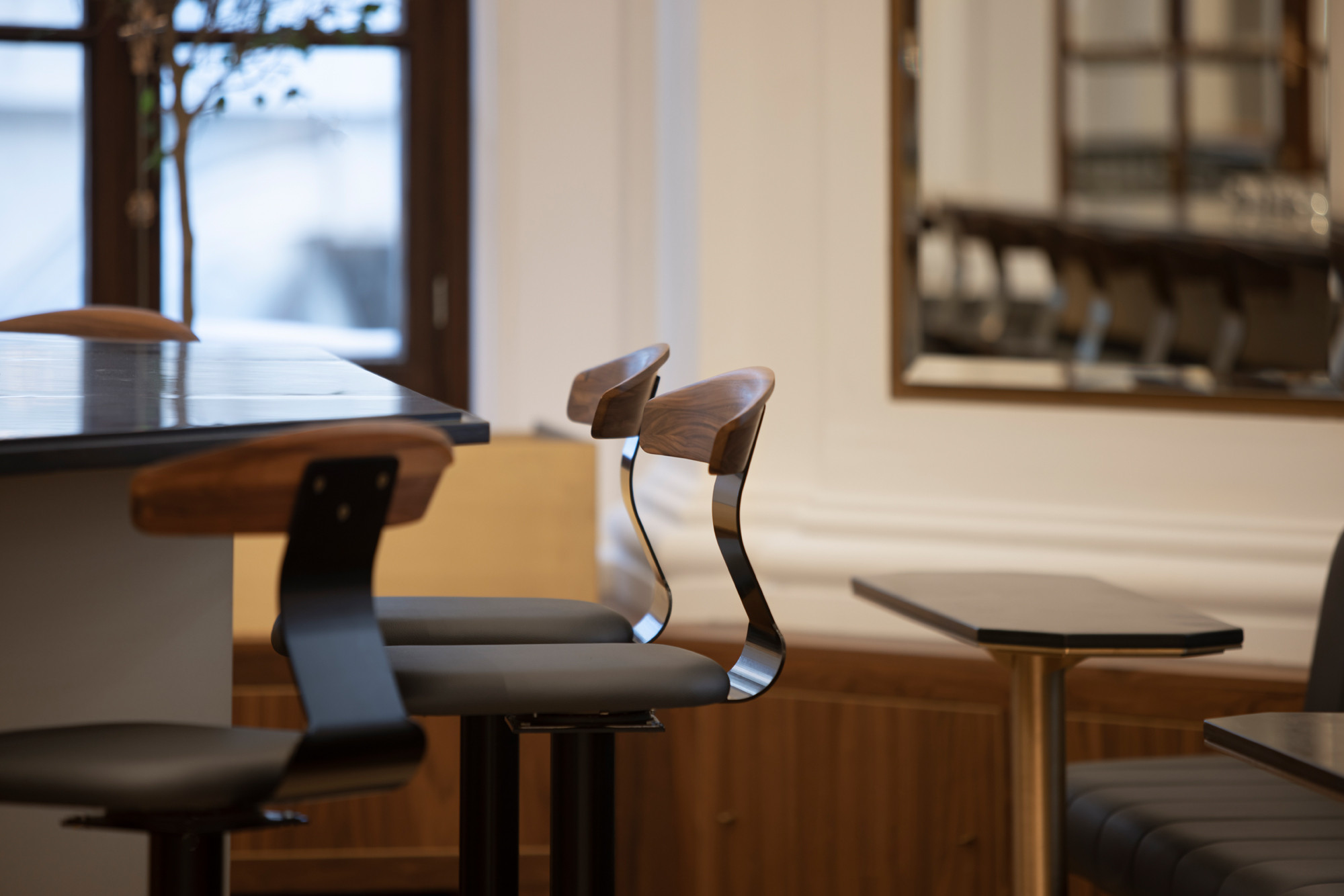 Detail view of custom bar stools in Le Parlementaire restaurant