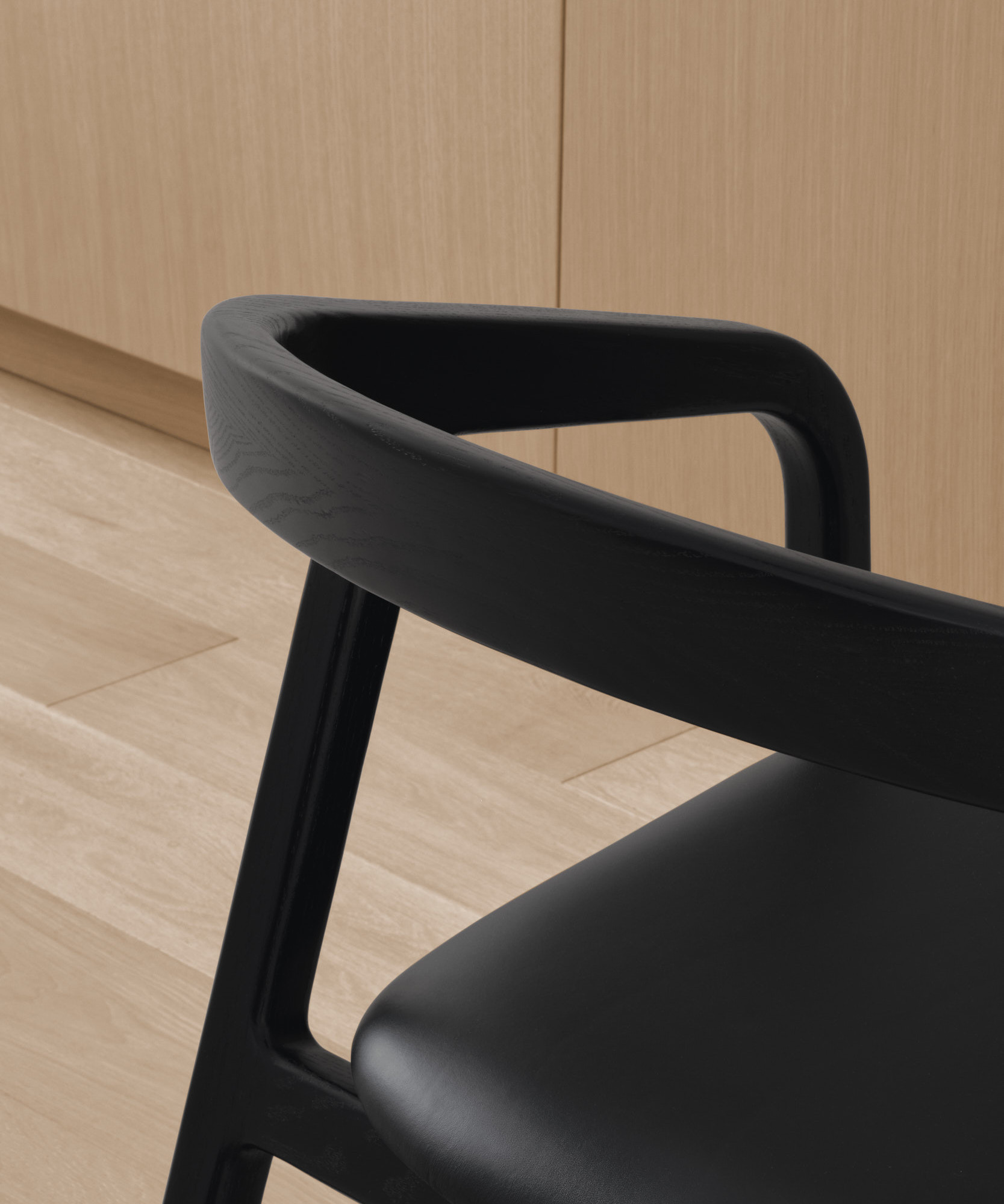 Detail of all black Olm chair