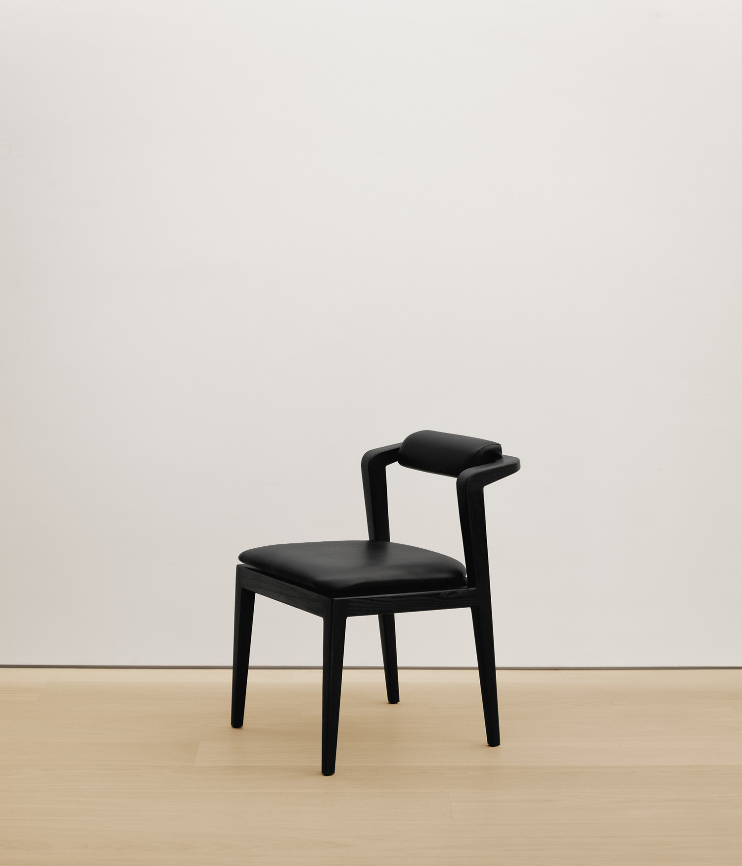  black-stained-oak chair with black color upholstered seat