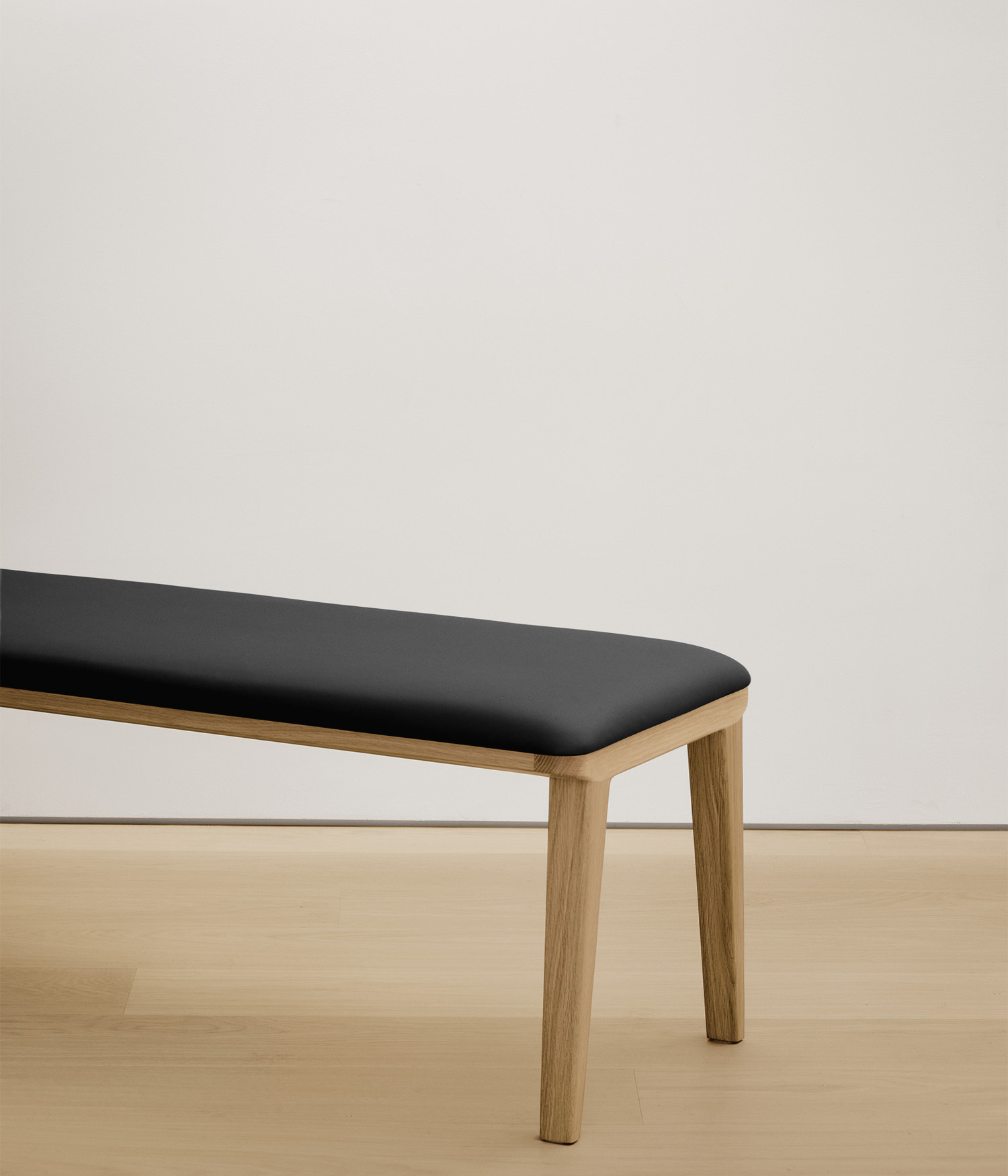  white-oak bench with black color upholstered seat