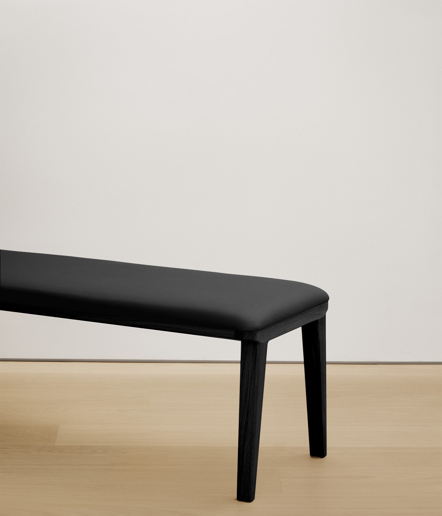  black-stained-oak bench with black color upholstered seat