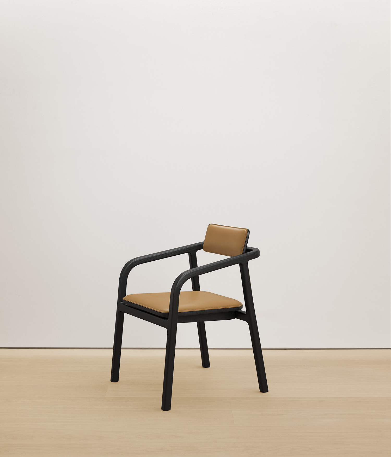  black-stained-oak chair with tan color upholstered seat 
