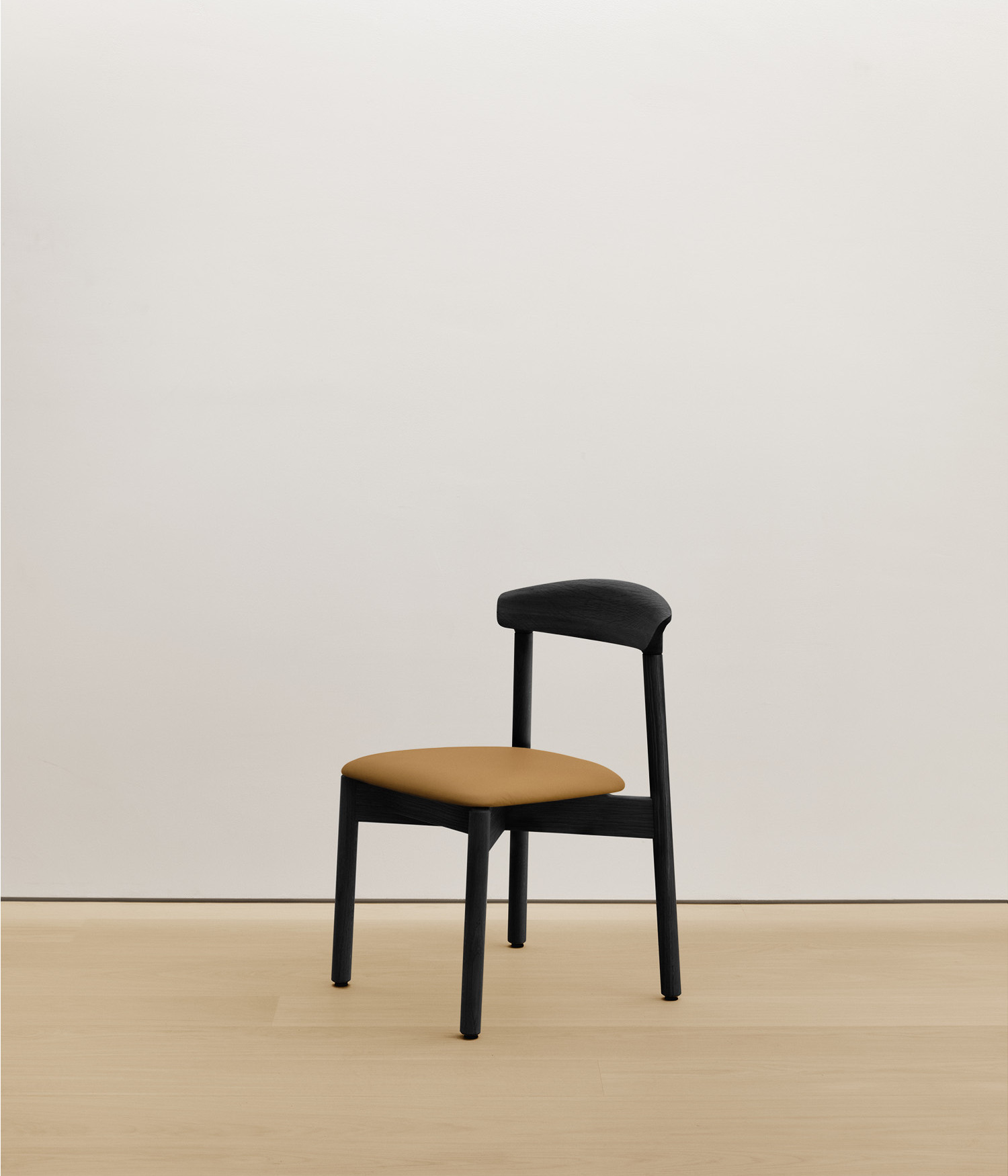  black-stained-oak chair with tan color upholstered seat 