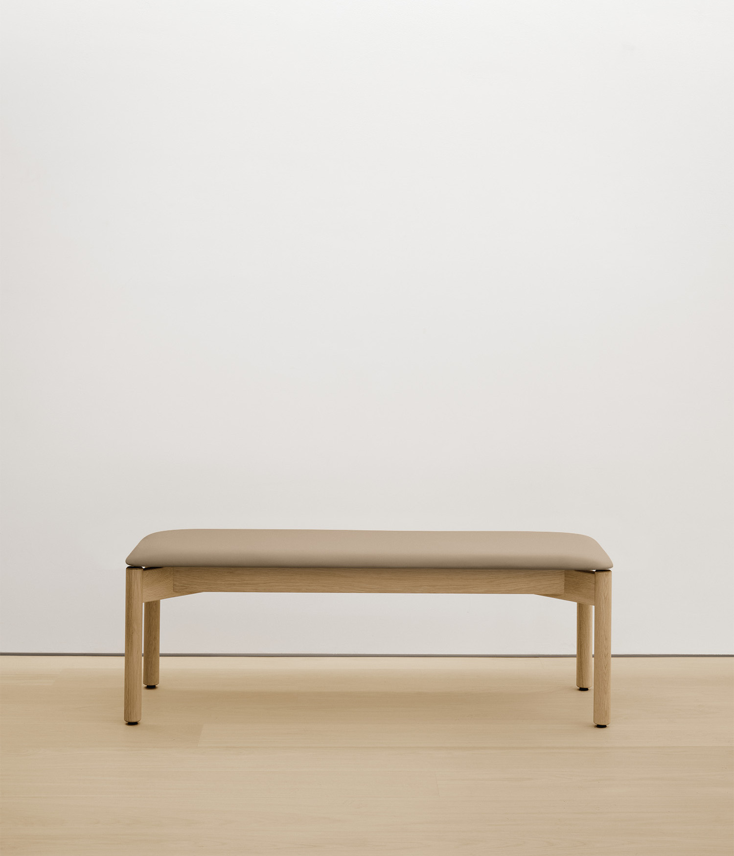 white-oak bench with cream upholstered seat