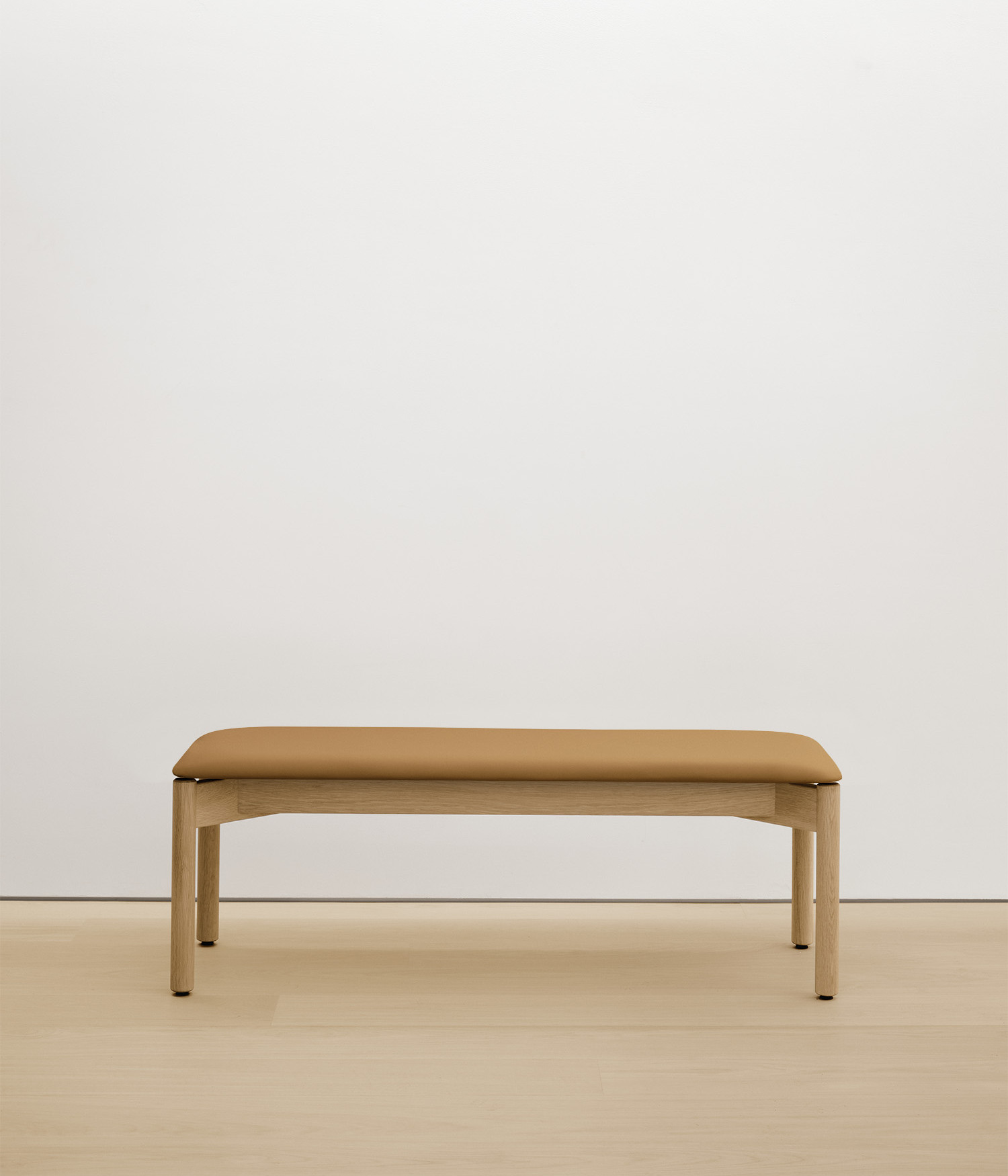 white-oak bench with tan upholstered seat