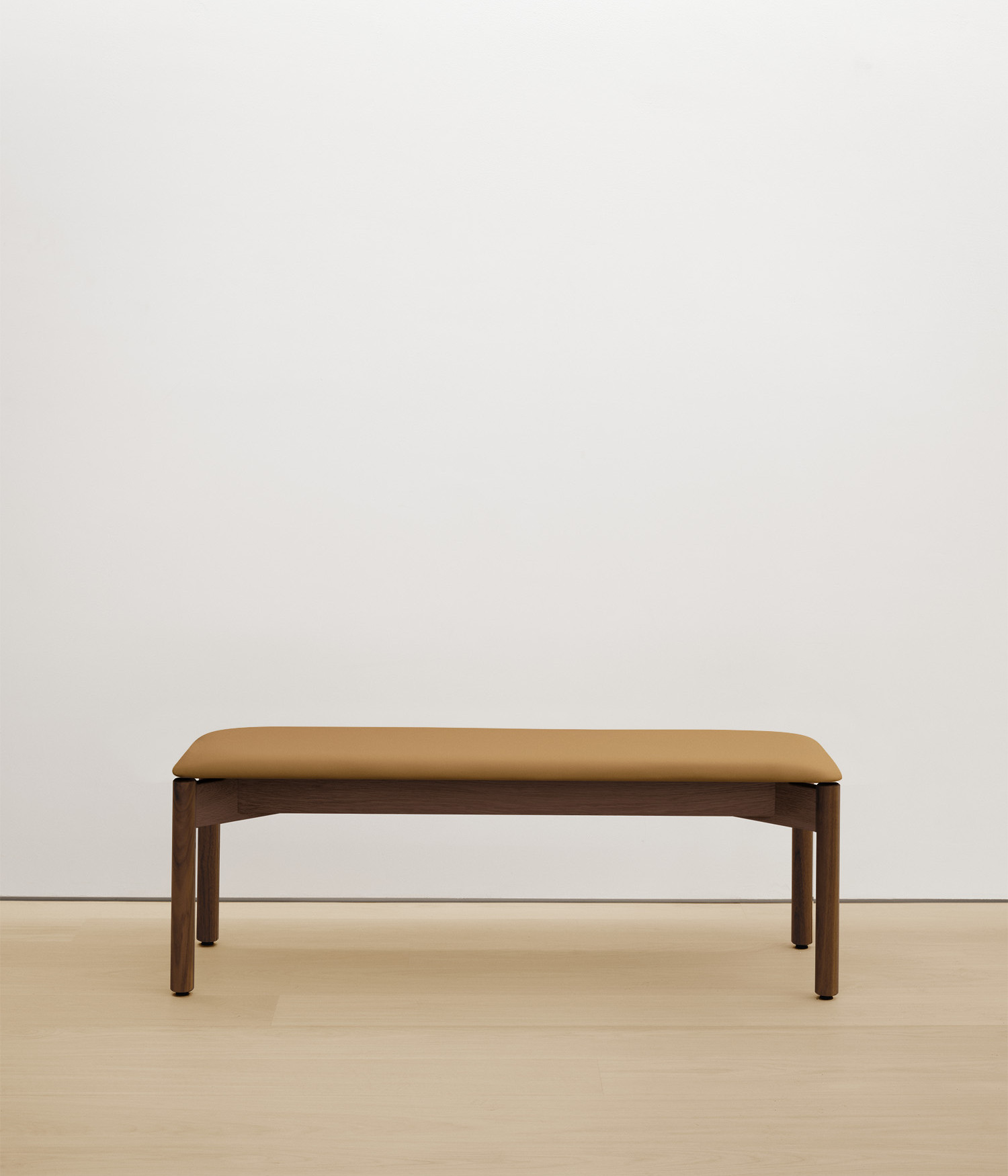 walnut bench with tan upholstered seat